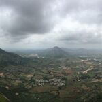 A panoramic shot of Nandi Hills captured during the rainy season.