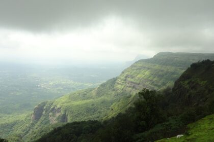 An image showing scenic hill stations and serene landscapes, showcasing the best places to visit near Pune in summer.