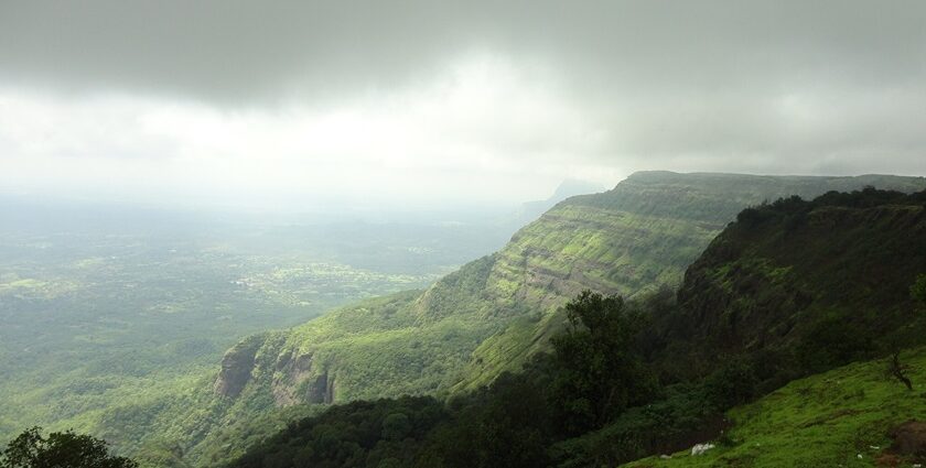 An image showing scenic hill stations and serene landscapes, showcasing the best places to visit near Pune in summer.