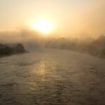 An image showing a stunning sunrise over Pune, capturing the city's skyline and nature.