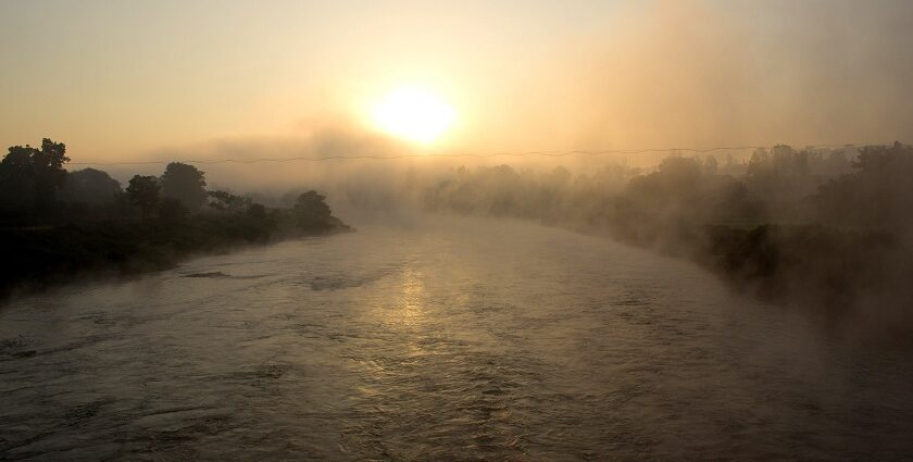 An image showing a stunning sunrise over Pune, capturing the city's skyline and nature.