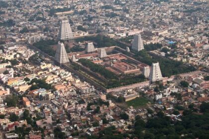 A scenic view of tranquil landscapes near Tiruvannamalai, surrounded by hills and greenery.