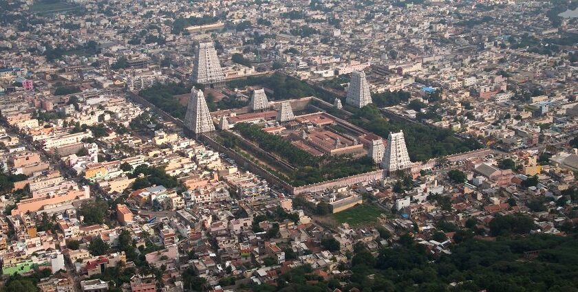 A scenic view of tranquil landscapes near Tiruvannamalai, surrounded by hills and greenery.