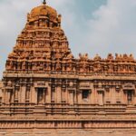 Picture of the sturdy, and very aesthetic Tanjore Temple along with its intricate details.