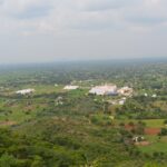 A picture of the scenic landscape of Dharmapuri showcasing lush hills and Hogenakkal Falls.