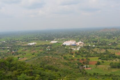 A picture of the scenic landscape of Dharmapuri showcasing lush hills and Hogenakkal Falls.