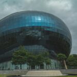 The round Infosys building features an innovative design promoting collaboration.