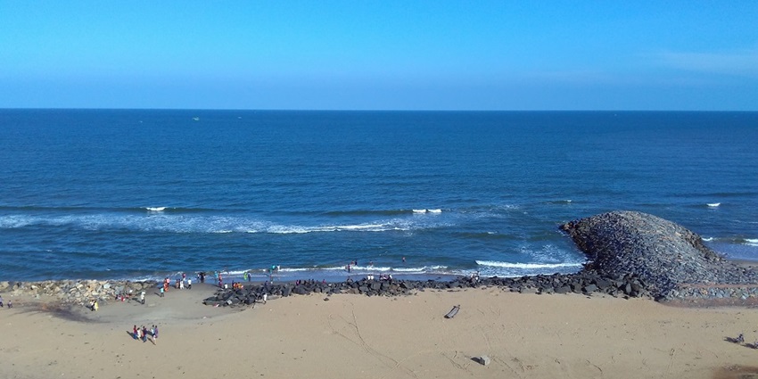 A view of the scenic Poompuhar Beach, a tourist attraction near Thirupampuram Temple.