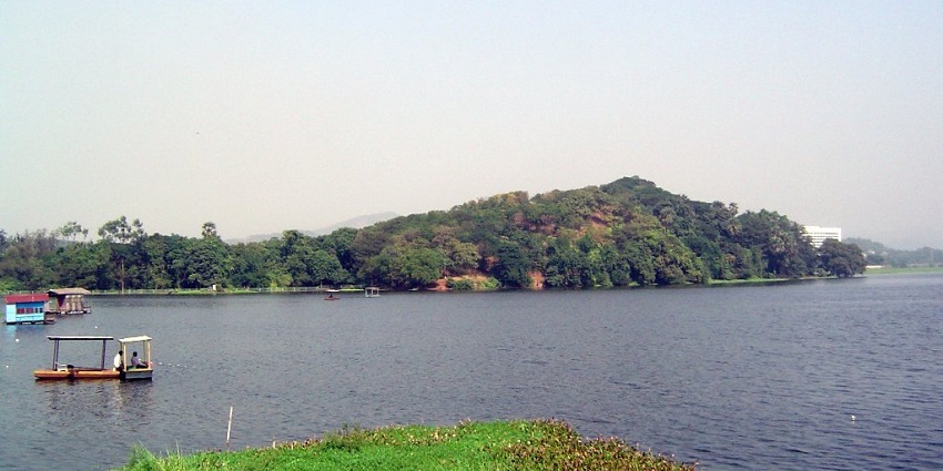 Powai Lake, surrounded by vibrant trees and modern architecture and one of the places to visit in mumbai central