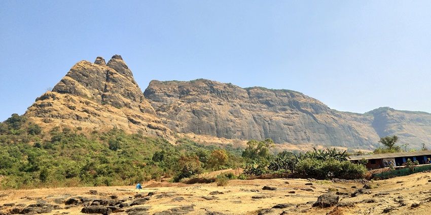 A picture of Prabalgad Fort with hilly surroundings, located approximately 47 km from Mumbai