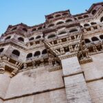 A stunning fortress towering on a rocky peak, evoking the grandeur of Prabalgad Fort.