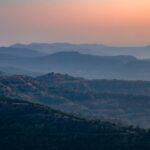 A glimpse of majestic mountains against a scenic backdrop in Maharashtra.