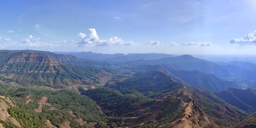 A picture of misty mountain roads that you can see during one of your road trips from Pune.