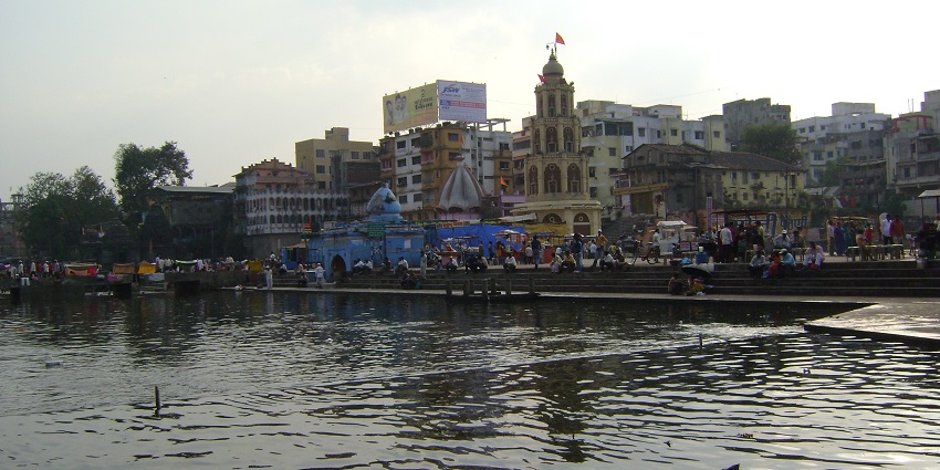A scenic picture of Ram Ghat, where visitors are taking a spiritual dip in the cold water.