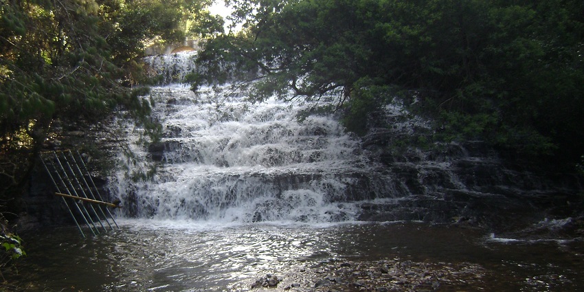 Scenic trek leading to stunning waterfalls and lush greenery.