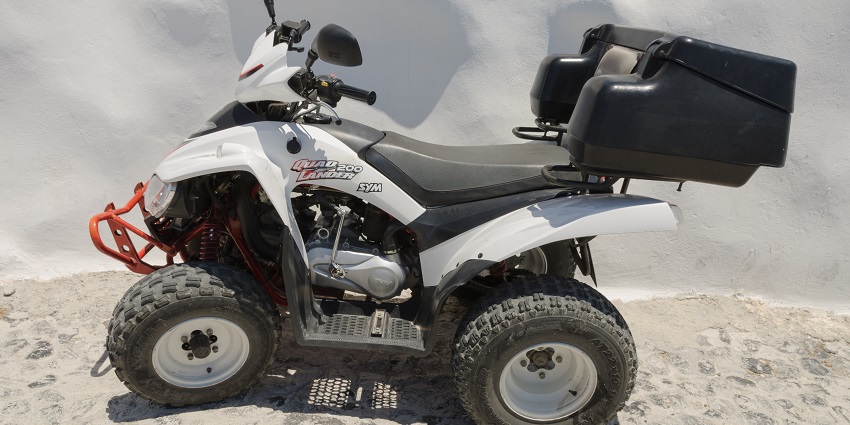 A SYM Quadlander 200 ATV parked in scenic location ready for adventure.