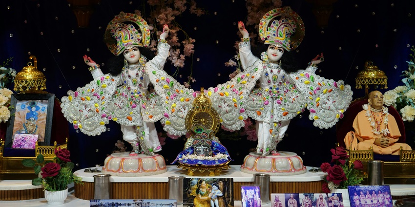 An inside view of the Radha Gopinath spiritual hub in Maharashtra featuring idols of God.