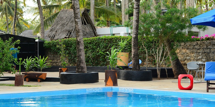 Upscale hotel featuring luxurious accommodations and top-notch services along with pool.