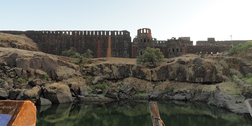 A wide view of Raigad Fort, surrounded by green forests, a famous place near Lingana Fort.