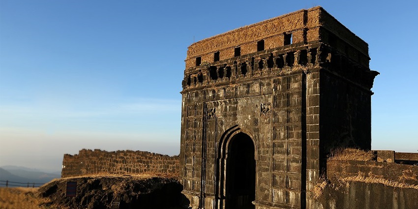 View of the Nagarkhana at Raigad Fort, a popular destination near Abchand Caves.