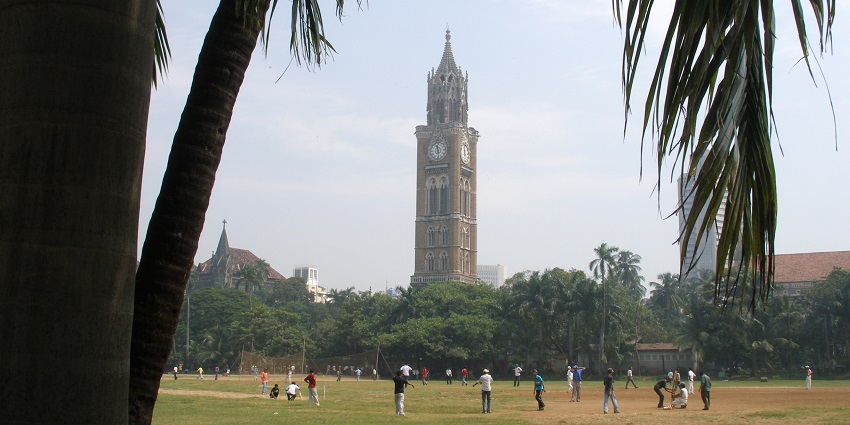 The clock tower in the background is a fusion of Venetian and Gothic-style architecture.