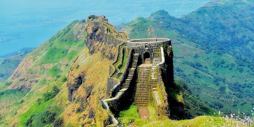 An image of the historical ruins at Rajgad Fort with panoramic views of the landscape.