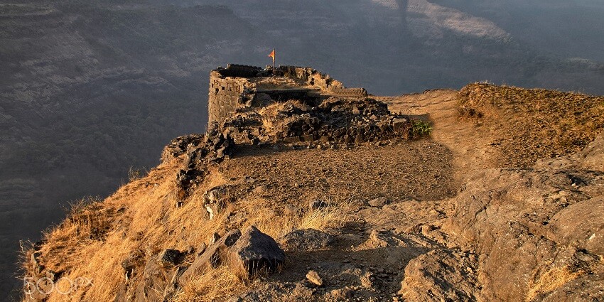 Rajmachi Fort and mist-covered peaks, must-see tourist attraction near Pune in monsoon.