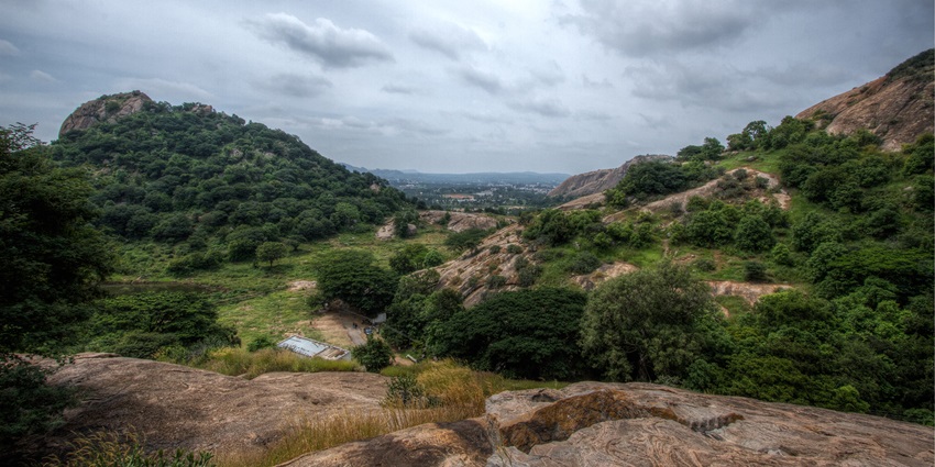 A panoramic view of the lush green ghats in the Ramanagara region of Karnataka