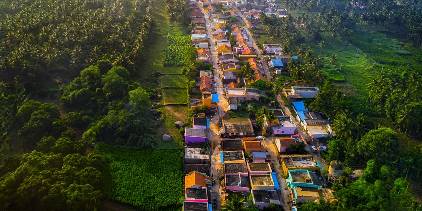 An aerial picture of a beautiful village in Ramanagara with flourishing greenery all around
