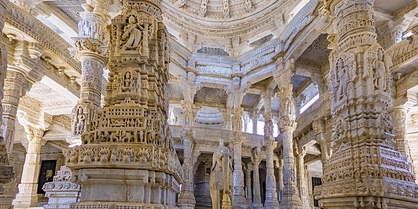 Close-up of the ornate pillars of the Ranakpur Temple, showcasing intricate carvings.