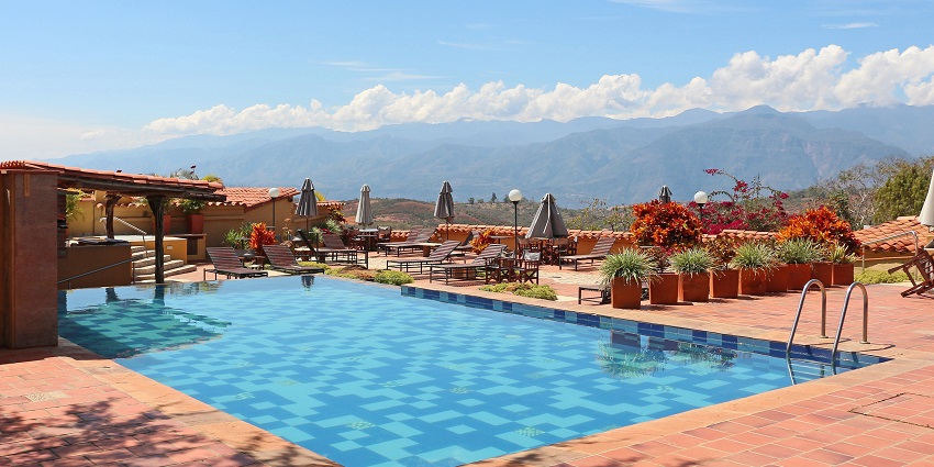 Image of pool and resort to cool off the summer during day time and clear blue sky