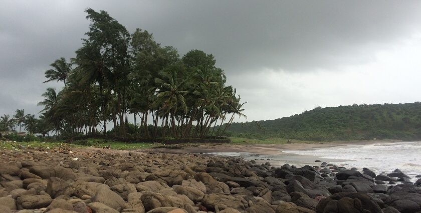 Serene beach view with golden sands and azure waters, a highlight of Ratnagiri Beaches.