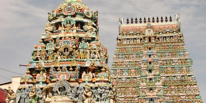 A photo of two tall, intricately carved gopurams of one of the Ravana temples in Tamil Nadu.
