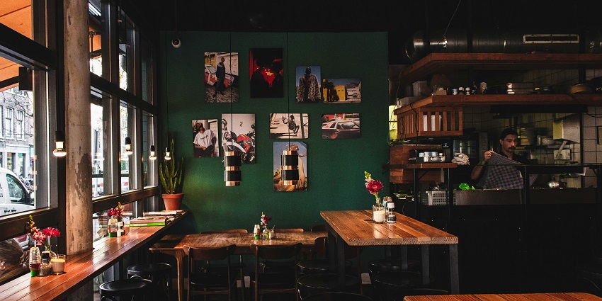 An inside view of Razzberry Rhinoceros in Juhu featuring aesthetically pleasing seating.