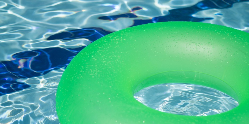 An image of the wave pool, with visitors riding the waves at Crescent Water Park Indore.