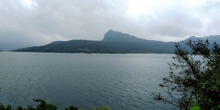 Things to see in Kamshet include Uksan Lake, surrounded by lush greenery and hills.