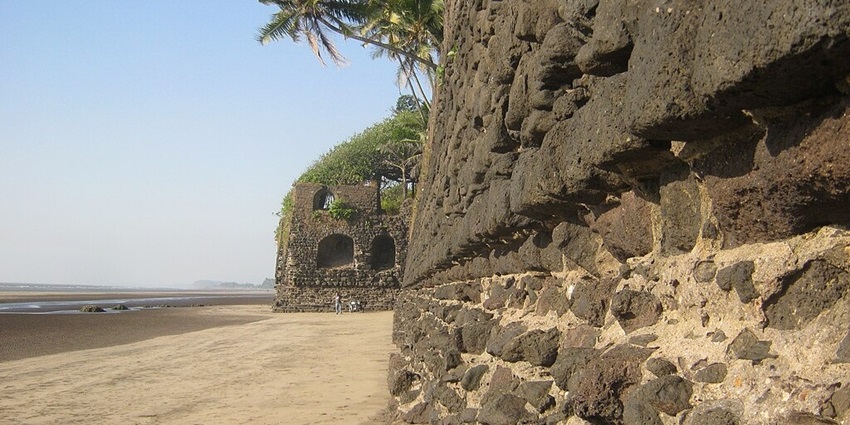 Outer walls of Revdanda Fort showcasing the weathered stone structure against a clear sky