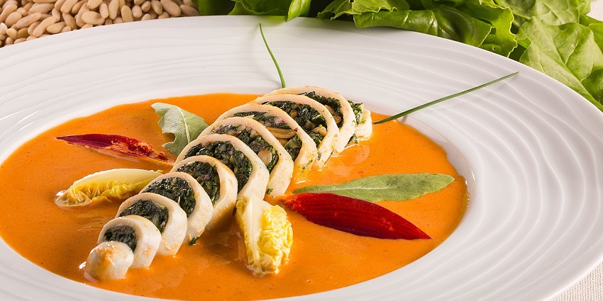 Small Squids, stuffed with spinach and pine nuts served in a gravy garnished with herbs, considered one of the best food in Nashik.