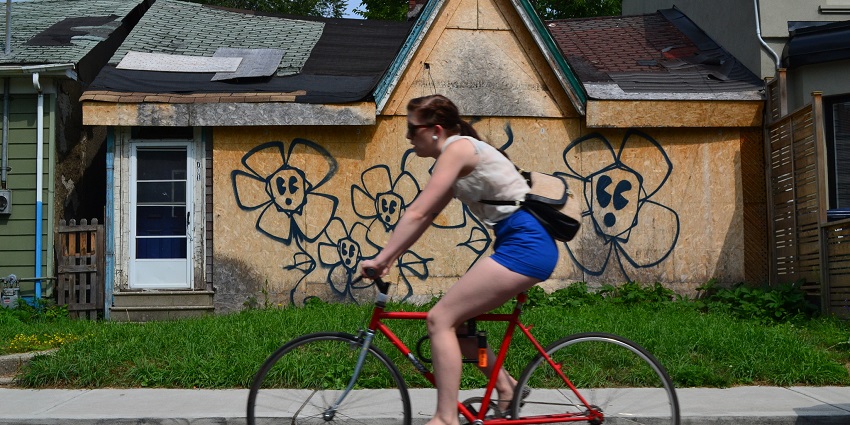 A woman on a scooter enjoying the ride.