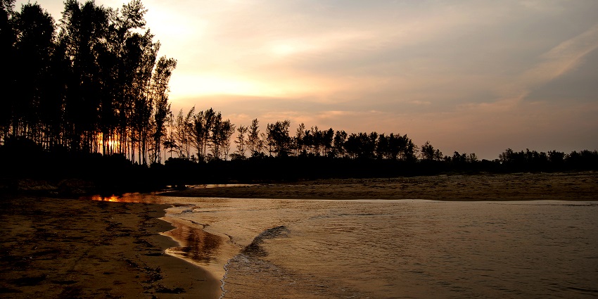 Sunset from Rock Garden, vibrant sky reflecting over serene landscape.