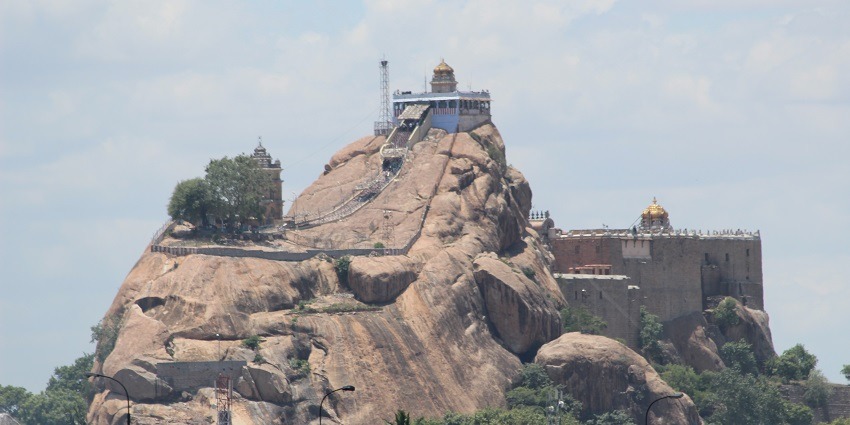 A historic temple perched atop a rocky hill, offering panoramic views of Tiruchirappalli.