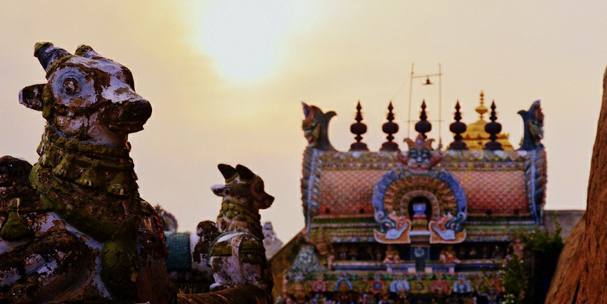A picture of the Rockfort temple complex with city views, showing the history all around.