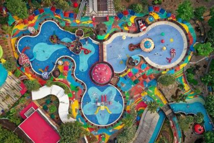 An aerial view of a Royal Water Park with colourful pools and slides in Vasai, Mumbai.