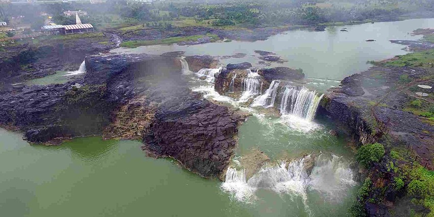 Picturesque waterfall surrounded by lush greenery, perfect for nature lovers.