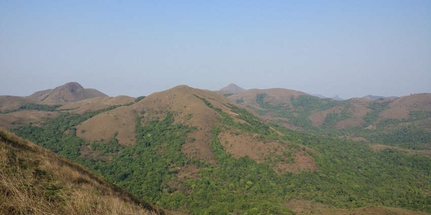 A picture taken from the Agani peak in Sakleshpur offering views of the scenic mountains nearby