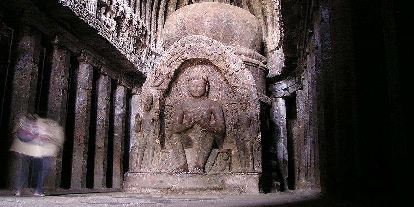 Buddha shrine within an intricately designed temple in India.