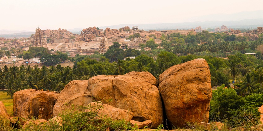 Ancient Jain site with rock-cut sculptures, meditation caves, and panoramic views near Madurai’s outskirts, situated near Pillayarpatti temple.