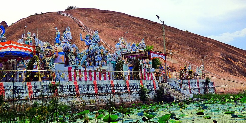 Tranquil hills featuring ancient rock carvings and scenic landscapes