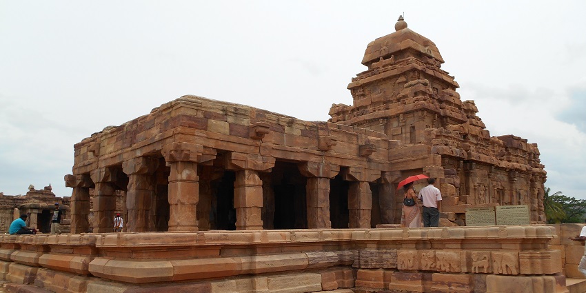 Sangmeshwar Temple features intricate carvings nestled in serene surroundings.