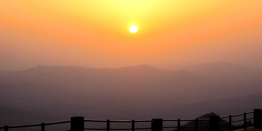 Golden sunset casts a magical glow over the tranquil Saputara Hill Station near Nanded